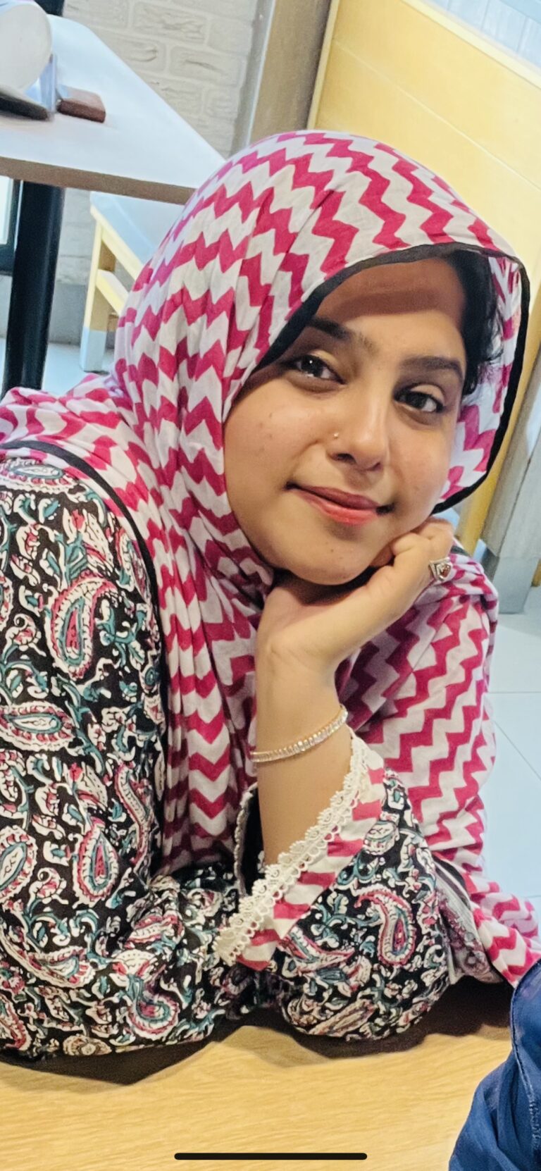 A woman in a red and white scarf