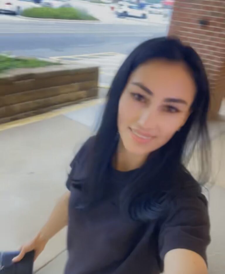 A Woman In A Black Color Top