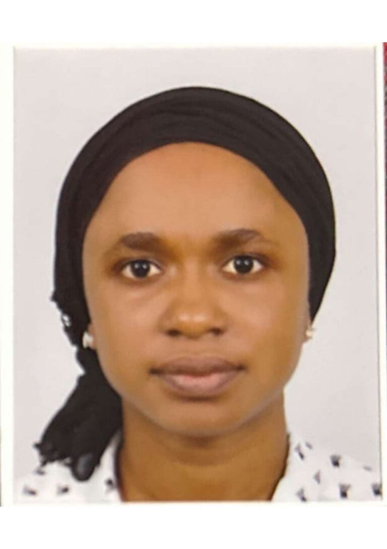 Portrait of a woman wearing a headscarf.
