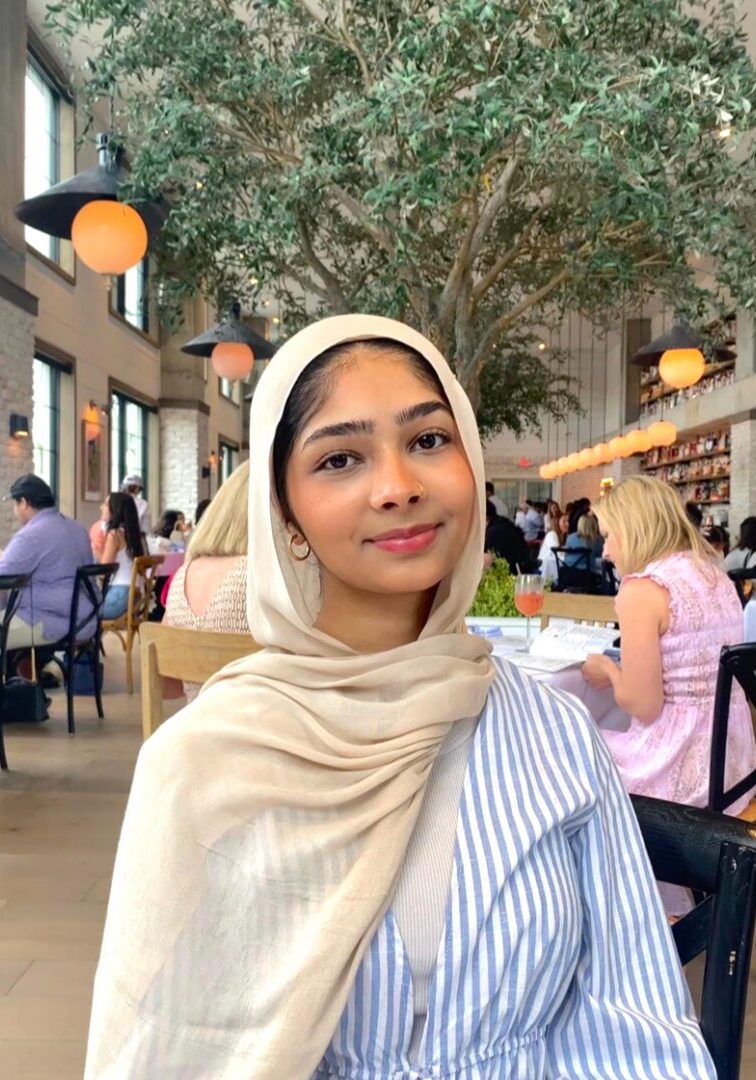Young woman in stylish indoor cafe.