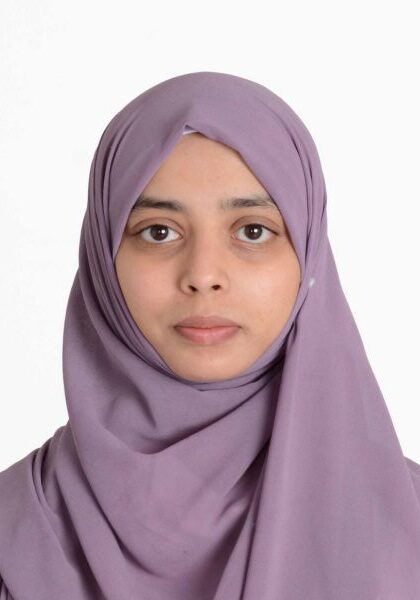Young woman in a purple hijab.